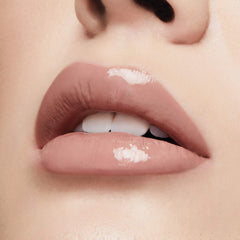 Milani gloss worn outdoors in daytime offering natural glow and quick touch-up benefit