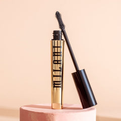 Milani tube next to ruler showing compact size for travel convenience