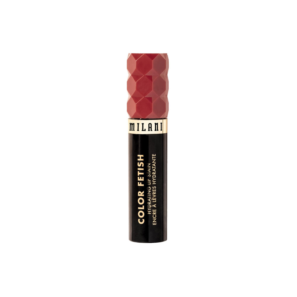 Milani Color Fetish tube next to a ruler showing compact size and travel convenience