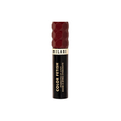 Milani tube next to hand to show size and easy purse portability