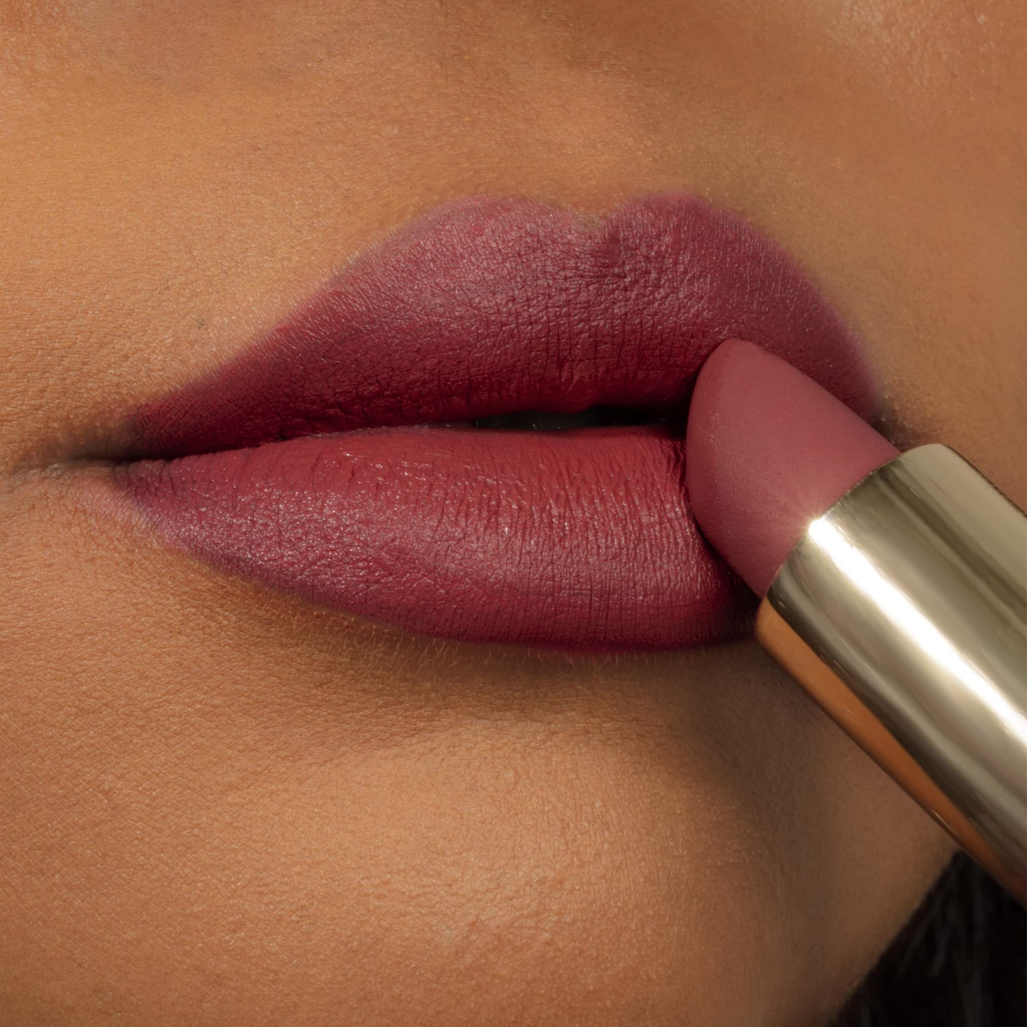 Milani size scale with coin showing tube dimensions and travel-friendly benefit