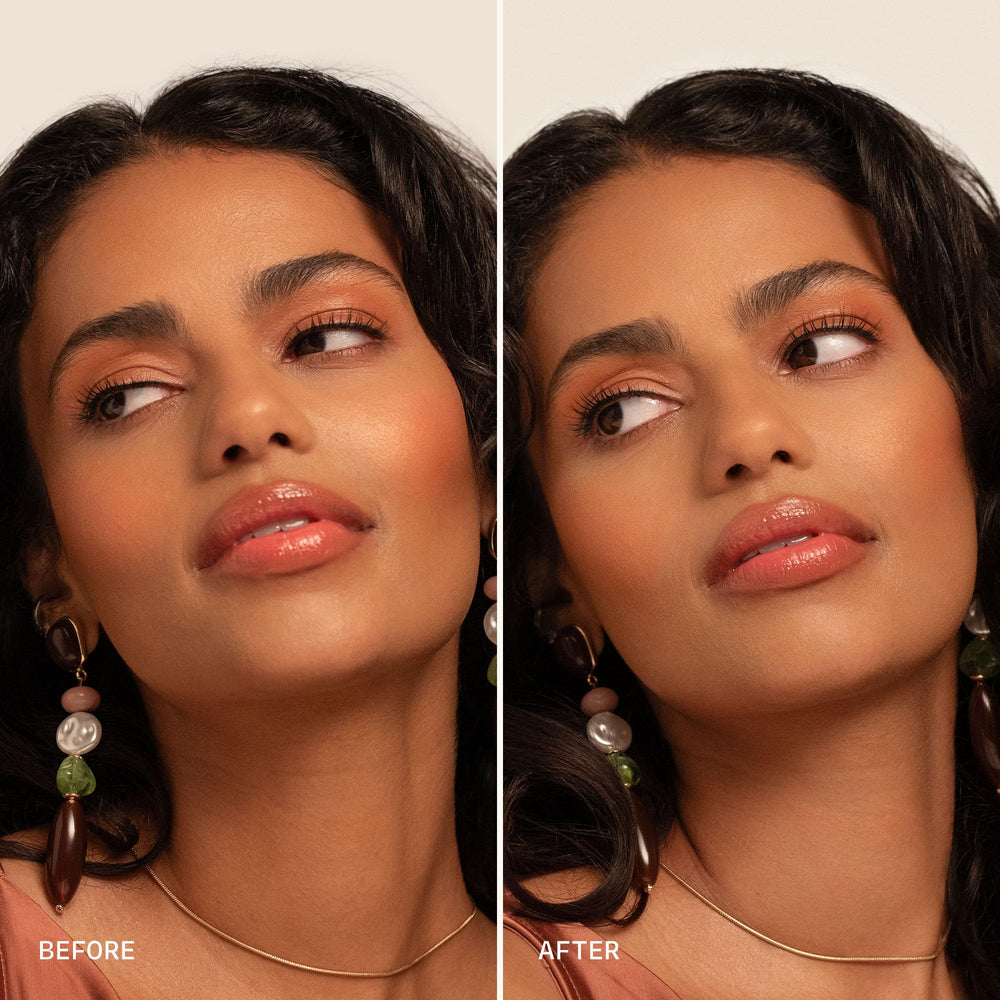 Milani misting over full face makeup to demonstrate long-lasting hold and refresh