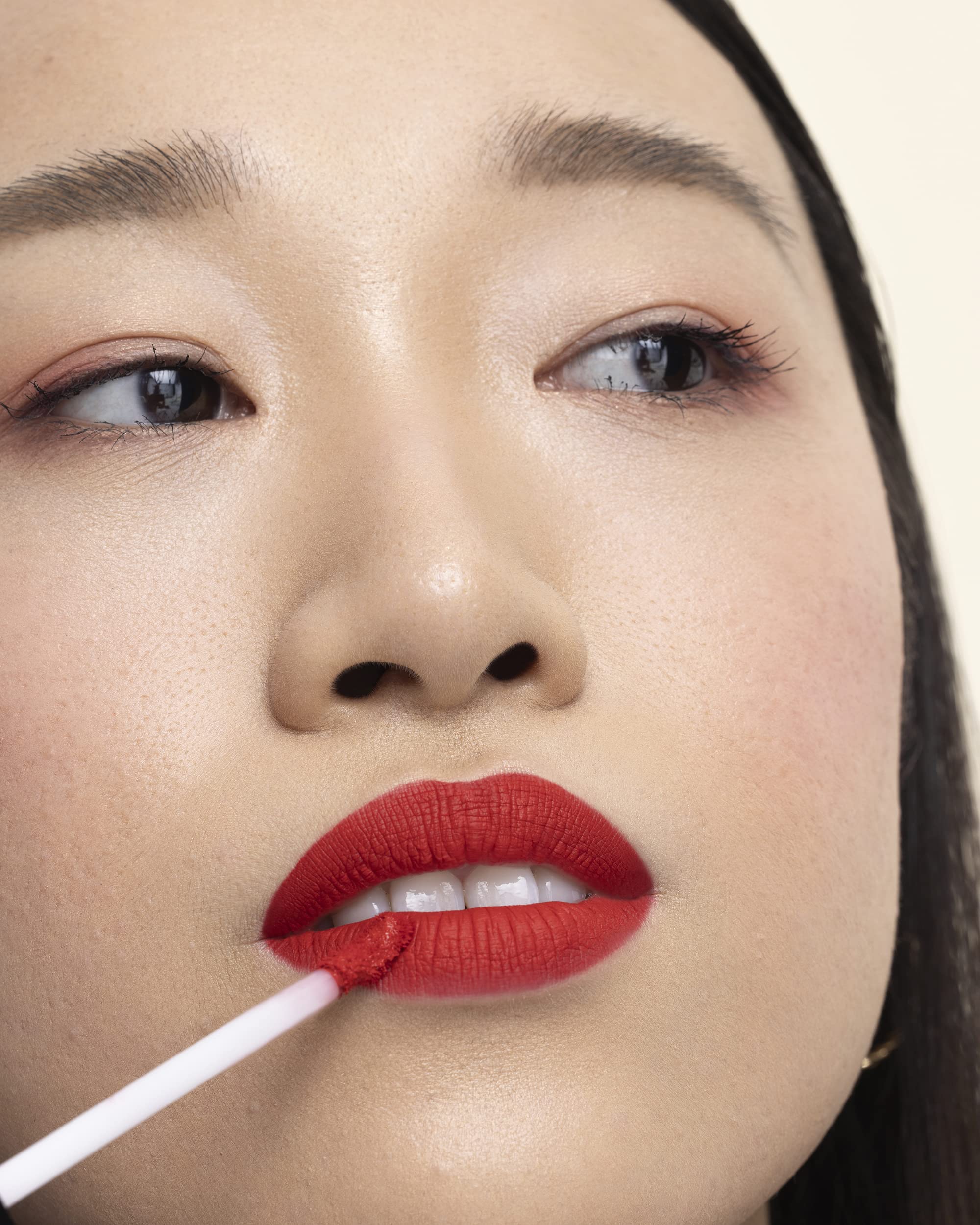 Milani worn on model lips, demonstrates true color payoff and all-day hold