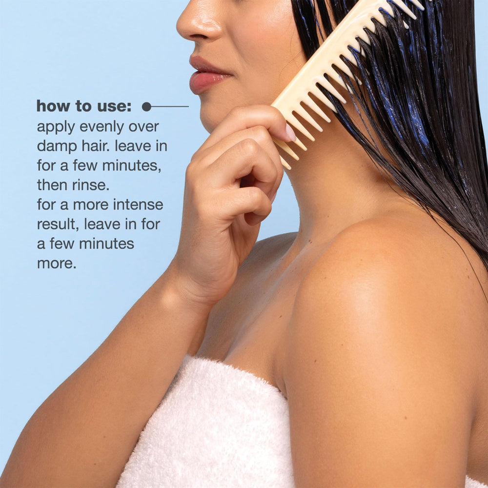 milk_shake blue pigment swatch on a brunette hair strand showing toning effect
