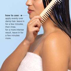 milk_shake blue pigment swatch on a brunette hair strand showing toning effect
