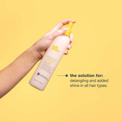milk_shake being spritzed on wet hair to show detangling and slip benefit
