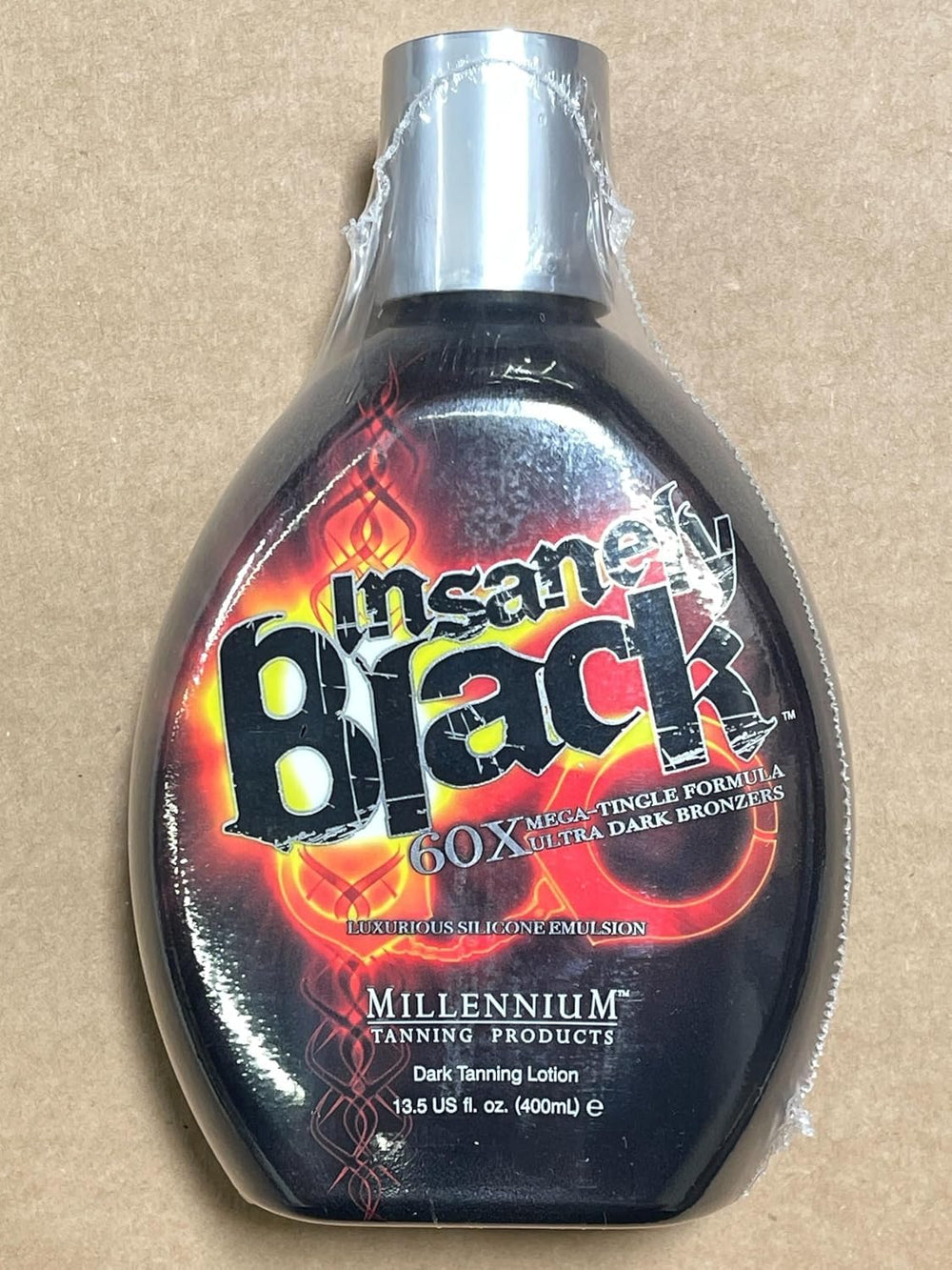 Millennium Tanning bronzed skin finish showing deep color and shimmer
