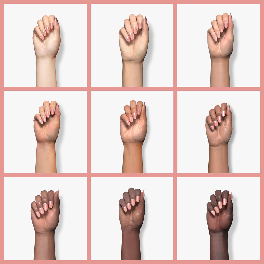 Mineral Fusion polish applied on nails showing even finish and wearable pink benefit