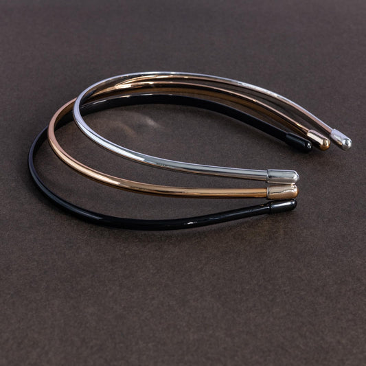minihope flat lay of black silver and gold headbands illustrating color choices and versatility