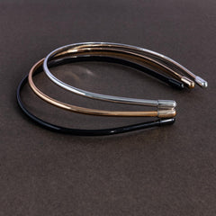 minihope flat lay of black silver and gold headbands illustrating color choices and versatility
