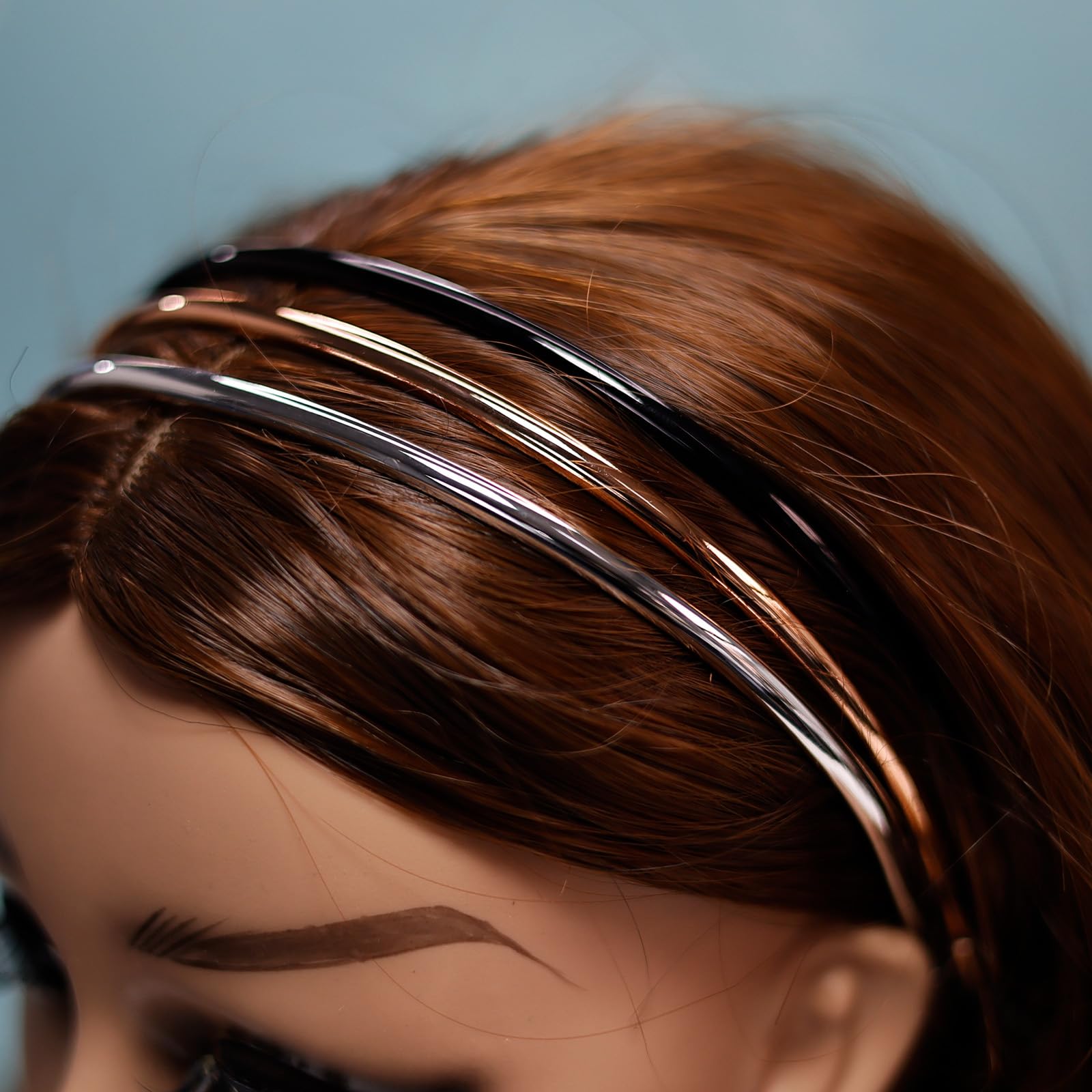 minihope headband held in hand to show scale and portability for on-the-go convenience
