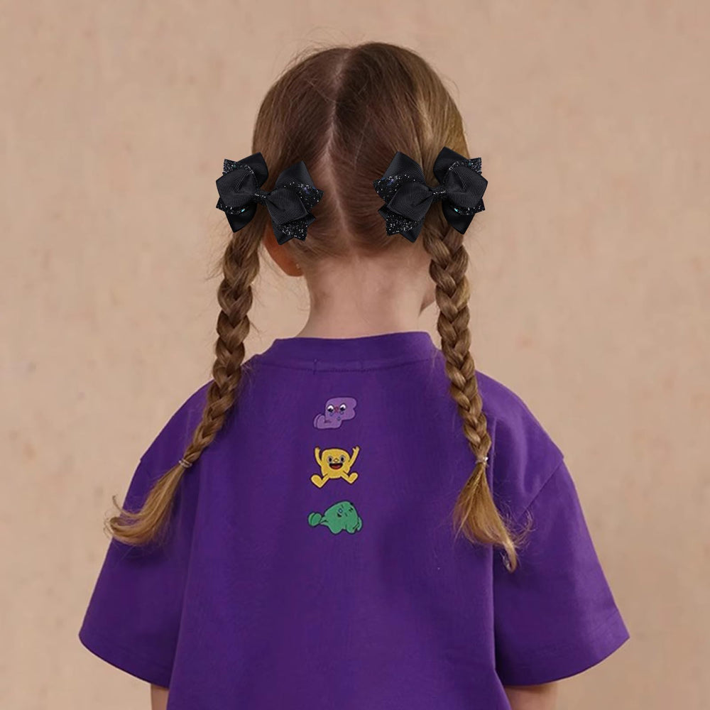 Miroksh bow clipped in ponytail adding instant shine and tidy look