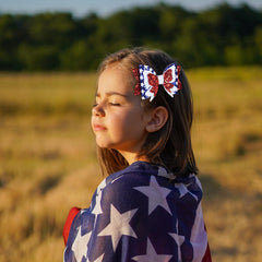 Miroksh bow worn in ponytail for children adding festive sparkle to hairstyle