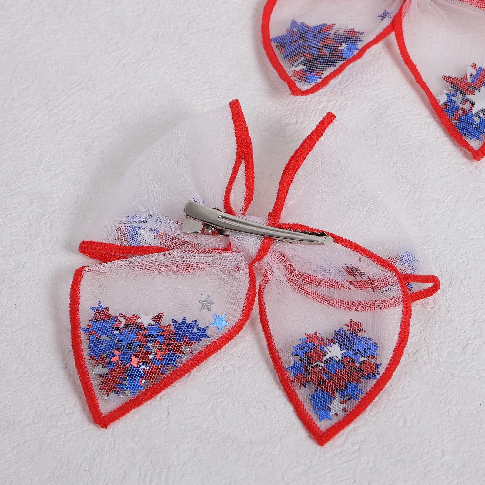 Miroksh bows styled in hair side profile adding patriotic flair to an outfit