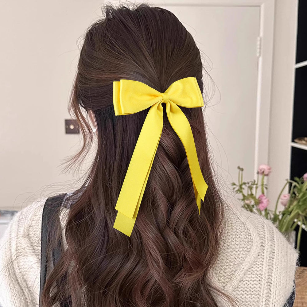 Miroksh bow clipped in ponytail showing instant polished style and movement