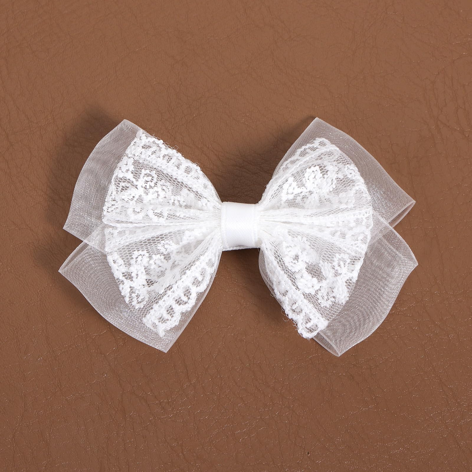 Miroksh bridal updo with bow showing decorative finish and photo-ready look