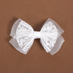 Miroksh bridal updo with bow showing decorative finish and photo-ready look