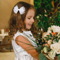 Miroksh child wearing bow in hair showing pretty accent and comfortable wear