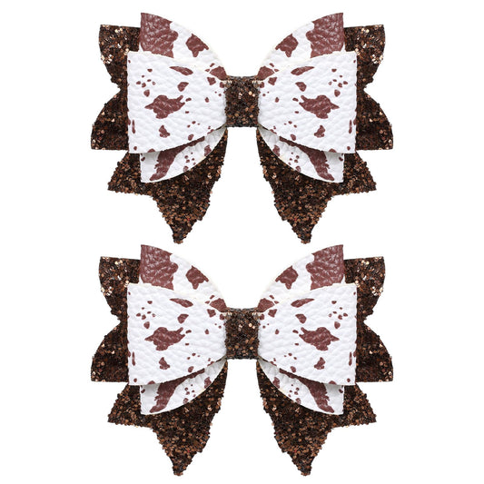 Miroksh front view of two glitter brown cow print bows showing size and shape, perfect party accent