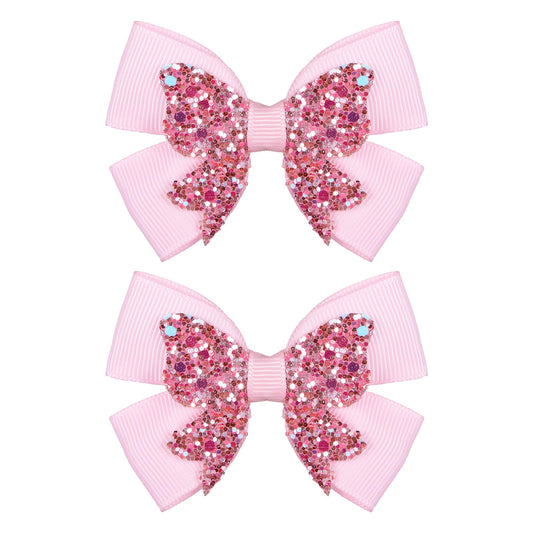 Miroksh front view of two glitter pink bow clips adds sparkle