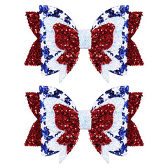Miroksh front view of two patriotic glitter hair bows showing festive colors and secure clip