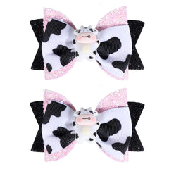 Miroksh front view bow pair showing cute cow print and sparkle benefit