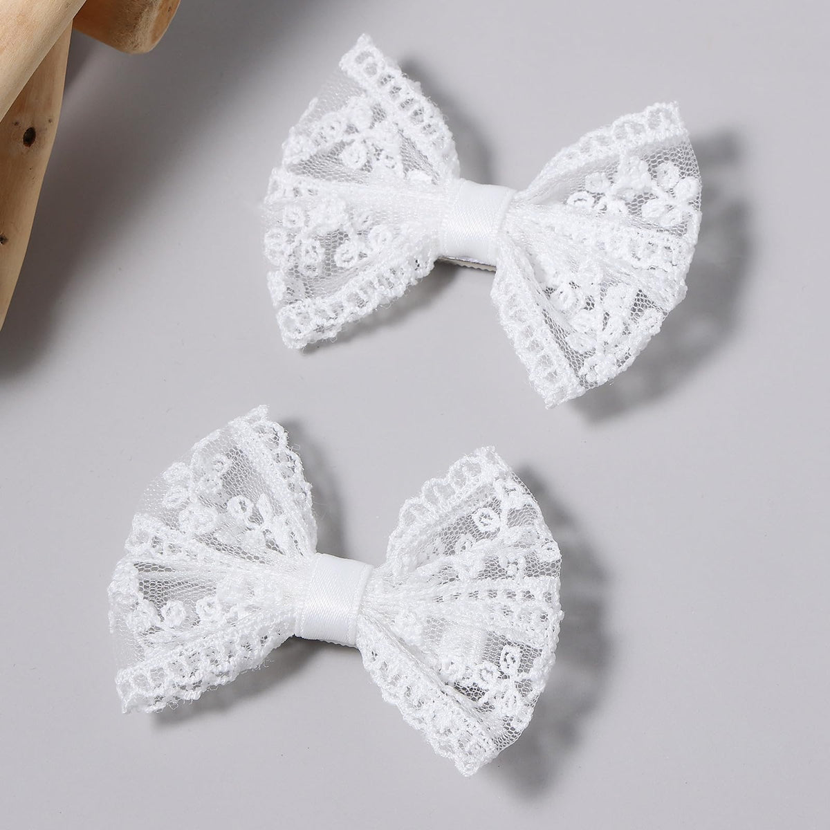Miroksh front view showing delicate white bows and classic elegance