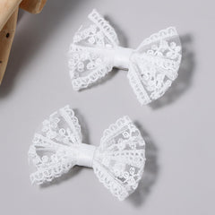 Miroksh front view showing delicate white bows and classic elegance