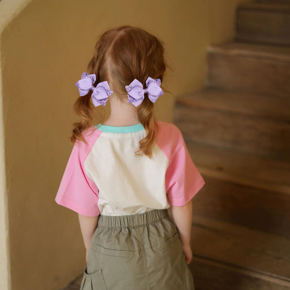 Miroksh bow clipped in ponytail demonstrating festive look and comfortable wear