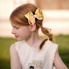 Miroksh lemon bow clip closeup showing alligator clip and secure hold