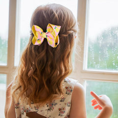 Miroksh lemon bow on adult hair adding tropical flair to outfit
