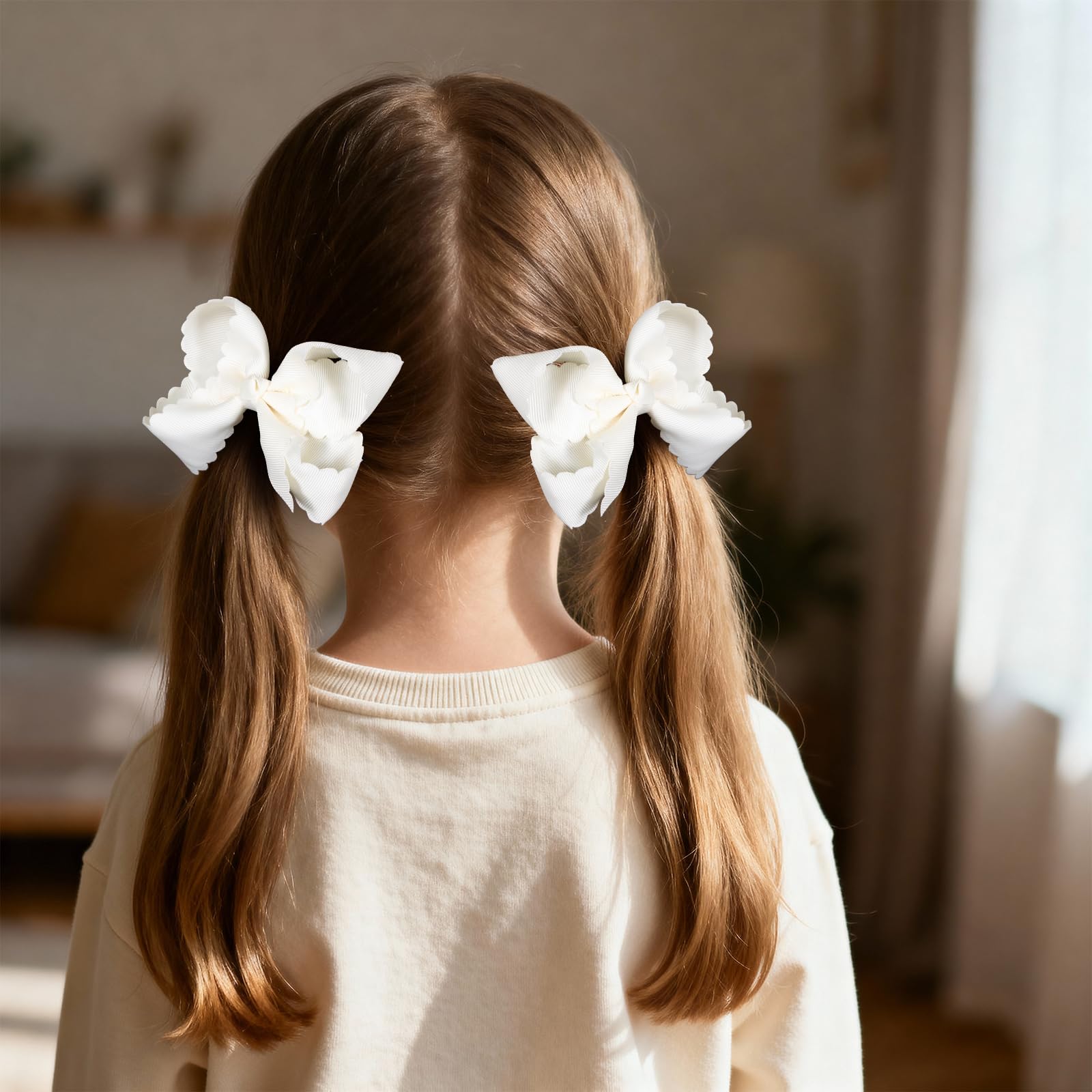 Miroksh bow in toddler pigtails securing hair and adding dressy charm
