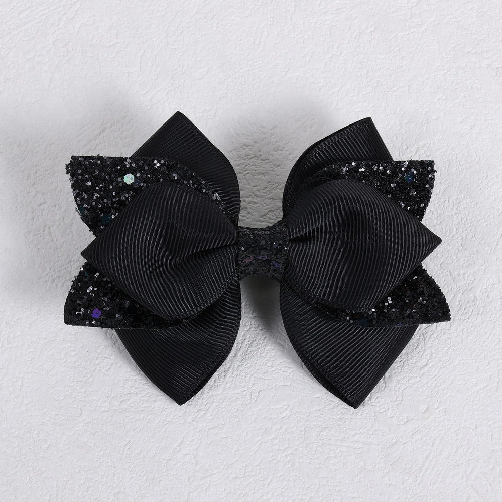 Miroksh paired bows worn with outfit illustrating coordinated accessory impact