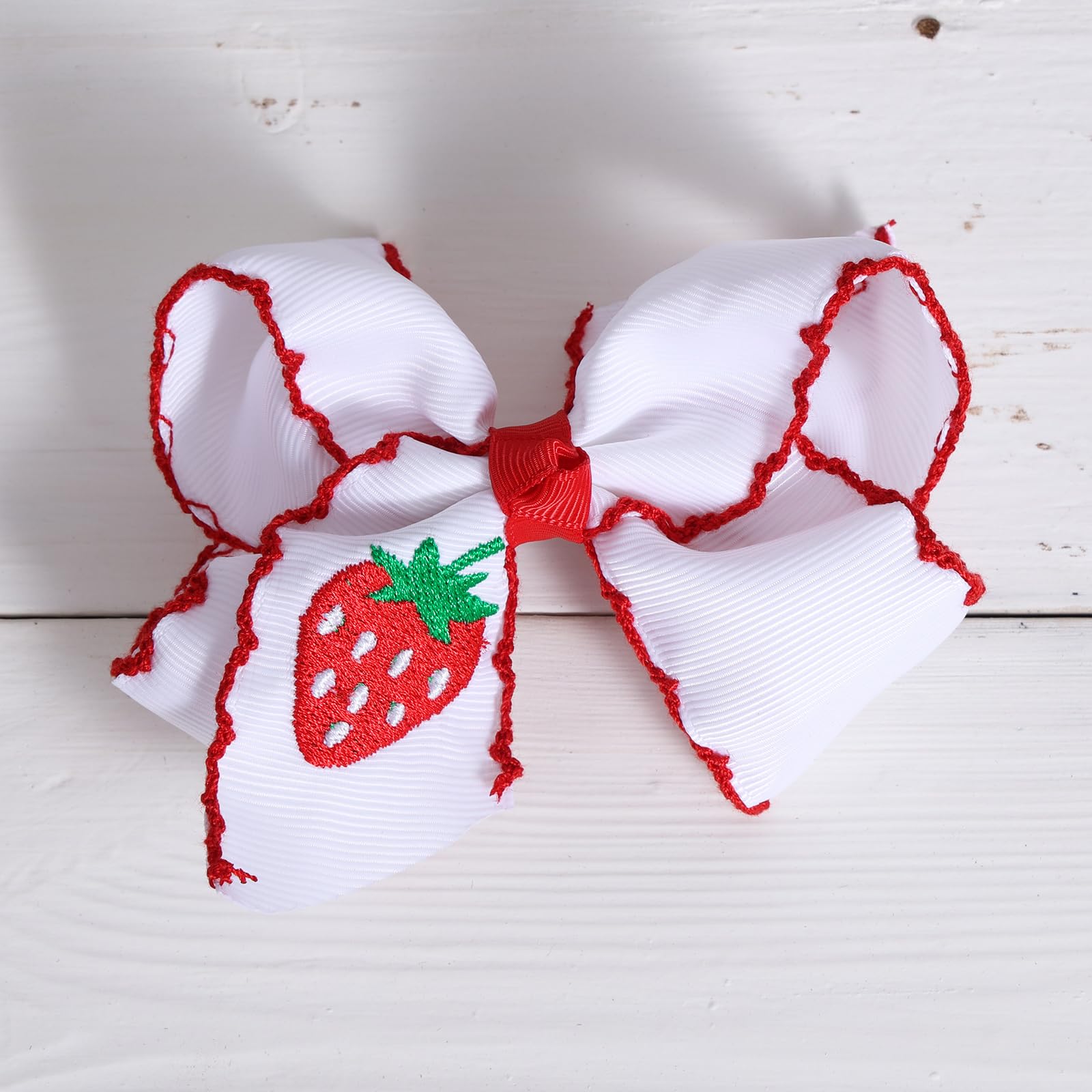 miroksh embroidered strawberry texture close-up highlighting handmade detail and charm