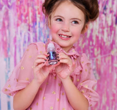 Miss Nella bottle in hand showing compact size and travel-friendly convenience
