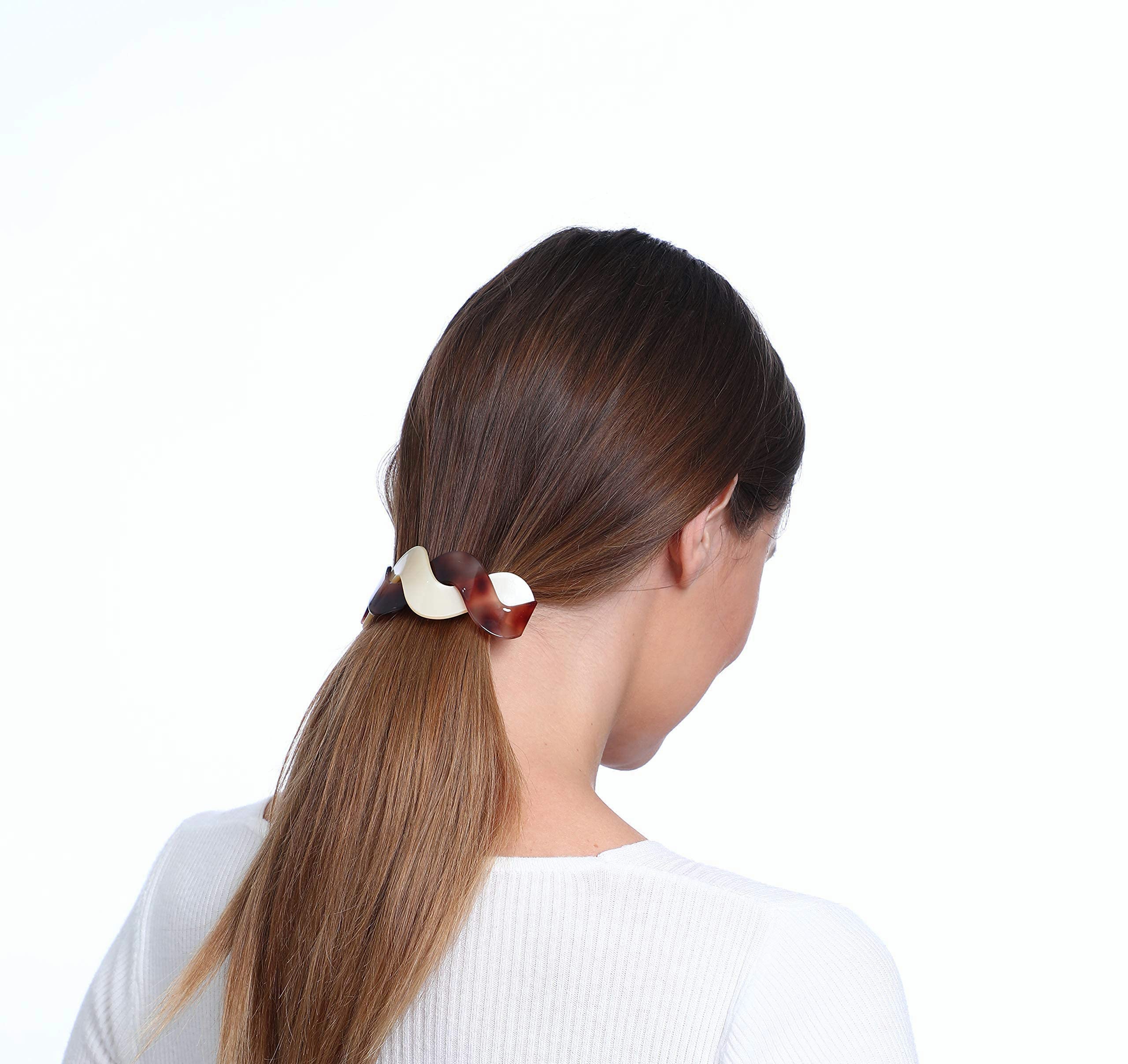 Mistofu worn in a half-up hairstyle demonstrating secure hold and timeless style