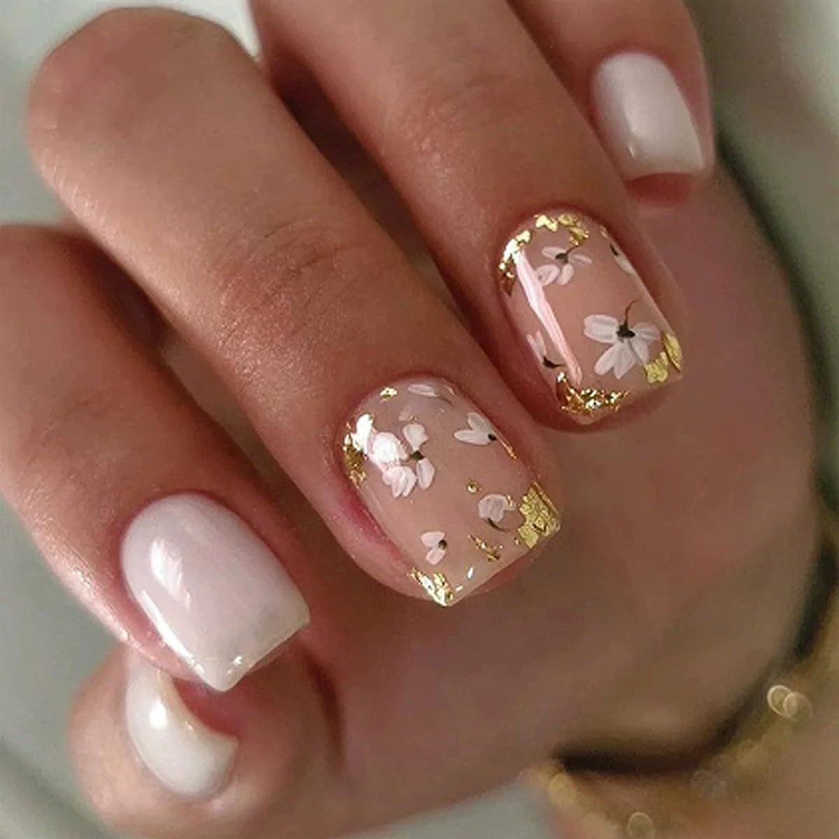 Mivota front box and nails showing white gold floral design and ready-to-wear benefit