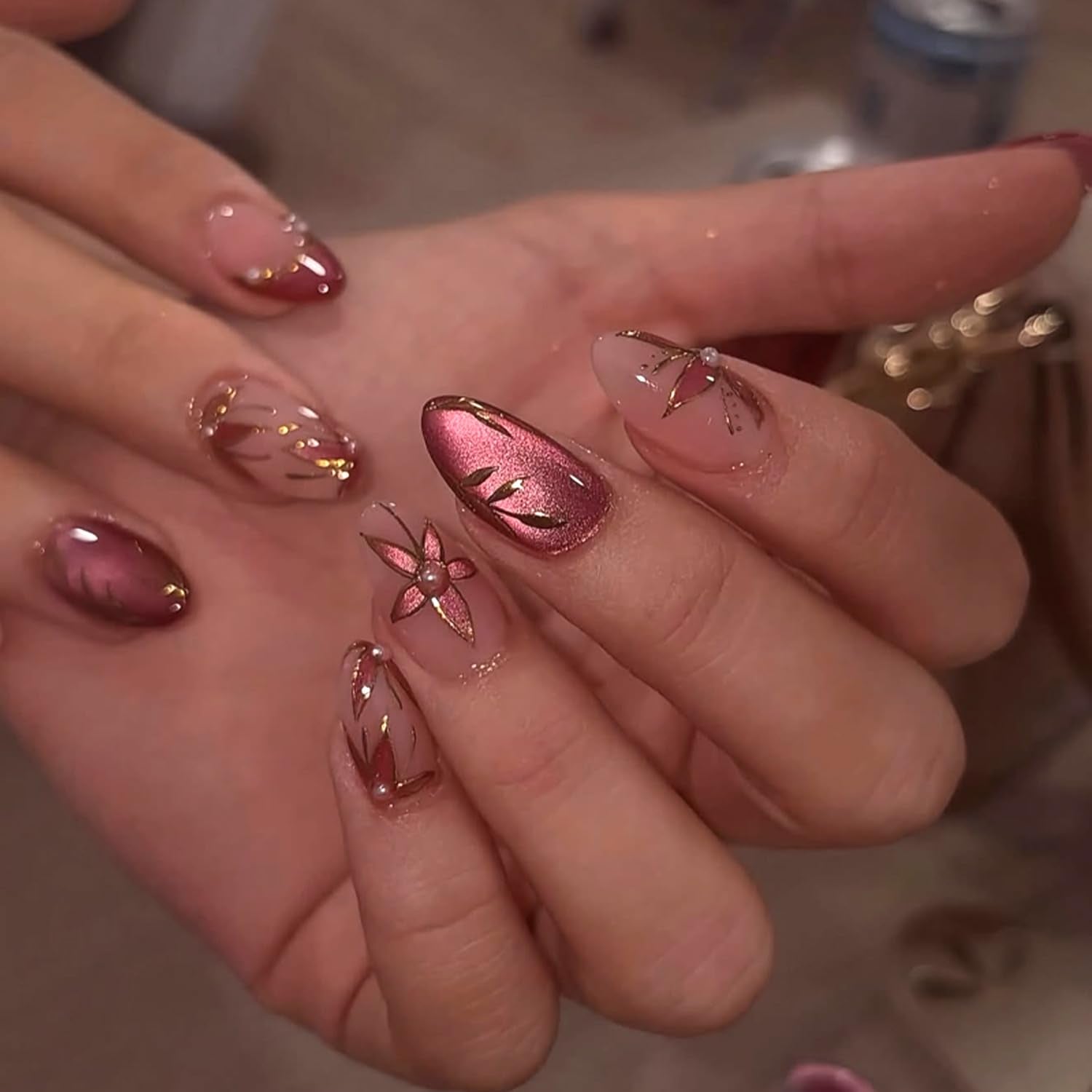 Mivota front view of almond red cat eye nails showing autumn elegance