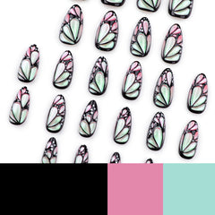 Mivota nails beside coin for scale, demonstrates size range and realistic fit