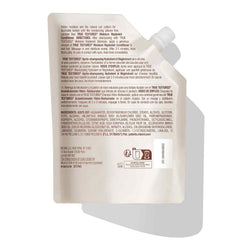 Mizani bottle on bathroom shelf in natural light suggesting salon-quality routine