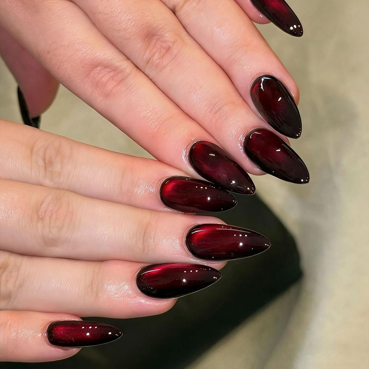 MJJNTTN front packaging showing burgundy cat eye nails and benefit of ready-to-wear manicure
