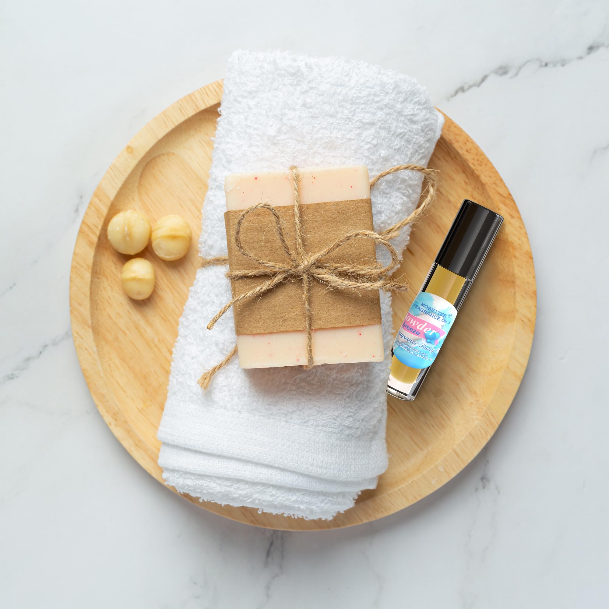 MOBETTER FRAGRANCE OILS bottle held in hand for scale highlighting travel-friendly size
