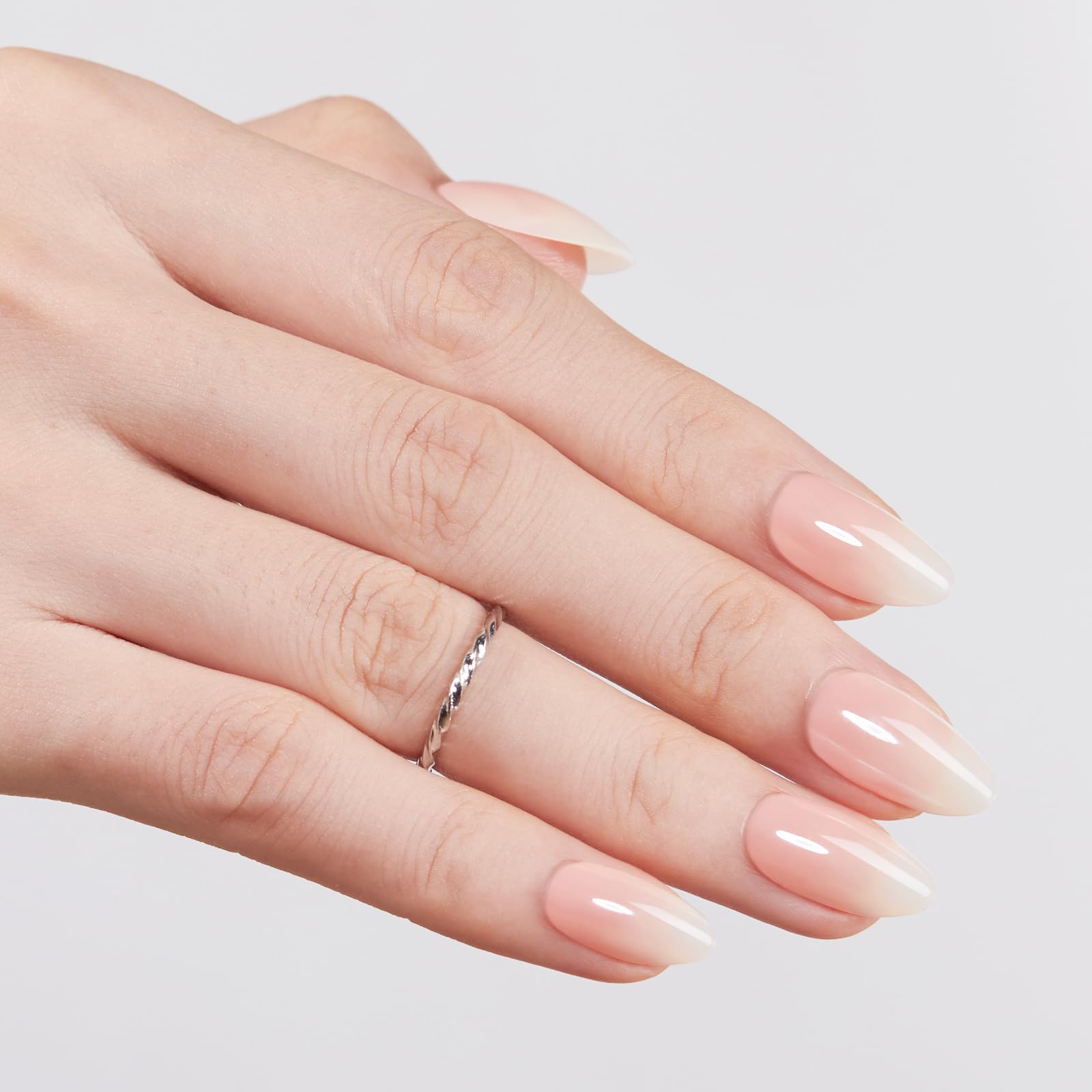 Modelones almond-shaped nails top view demonstrating elegant tapered silhouette