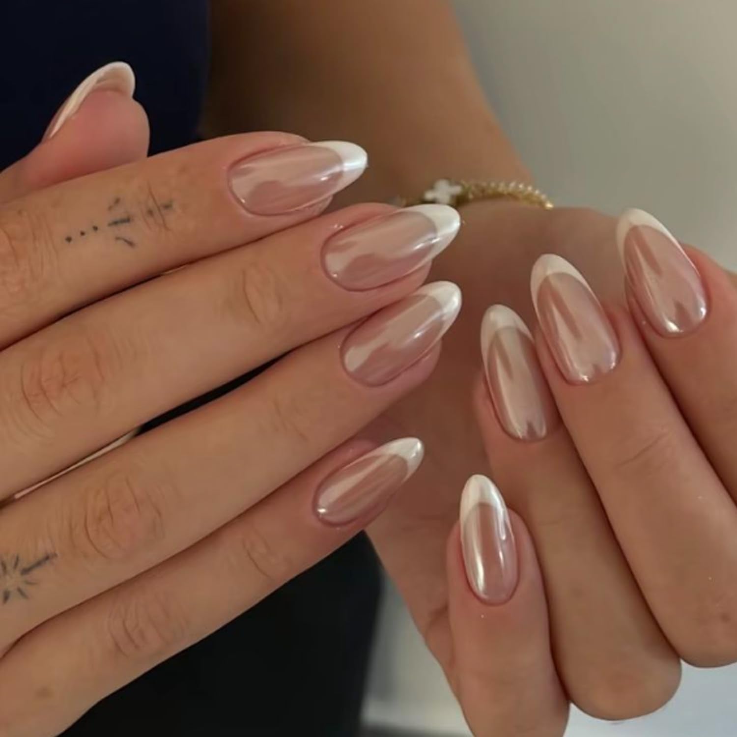 Modelones close-up of chrome French tip texture highlighting smooth shine