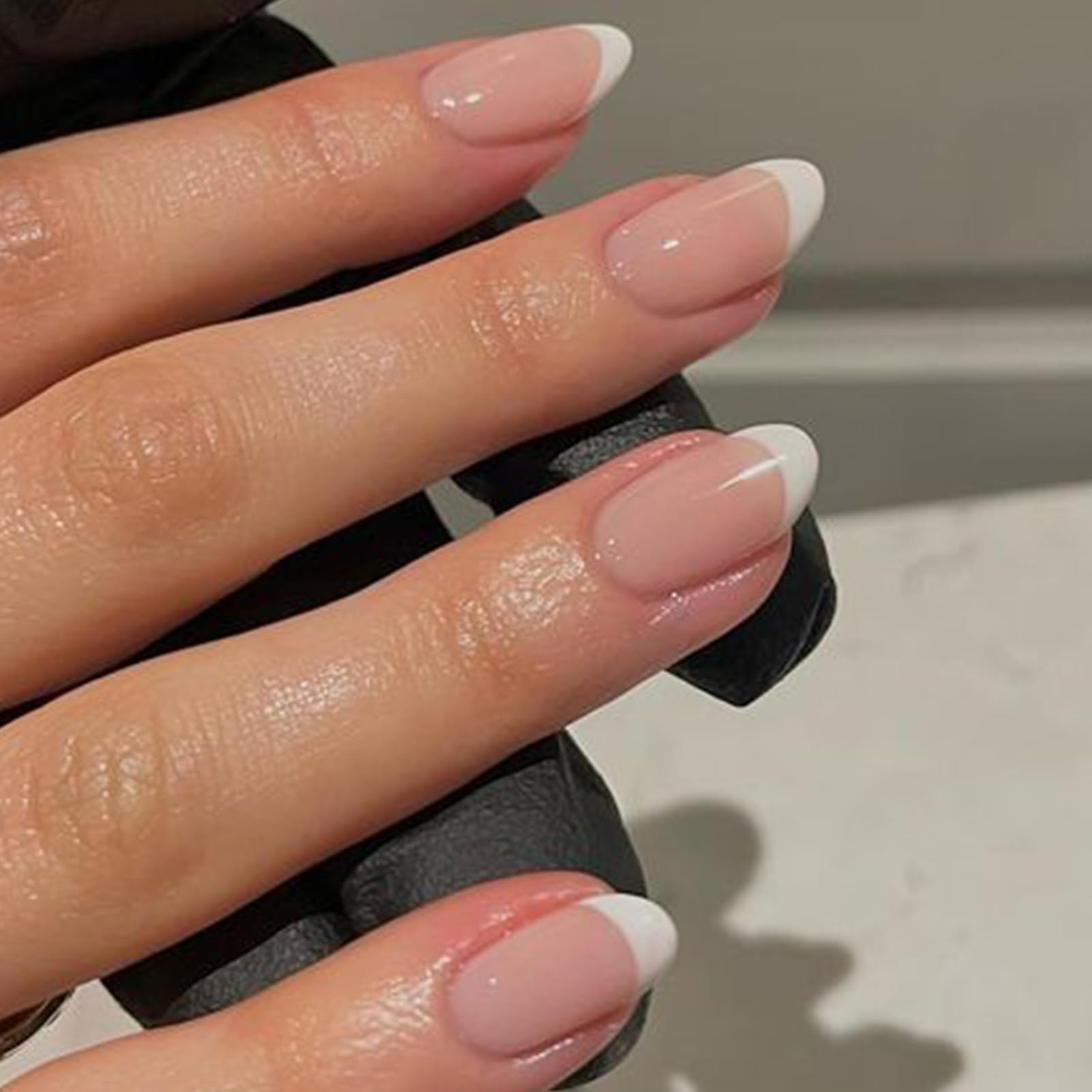 modelones close-up of French-tip curve highlighting smooth finish and salon look