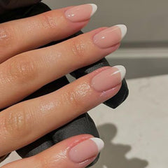 modelones close-up of French-tip curve highlighting smooth finish and salon look
