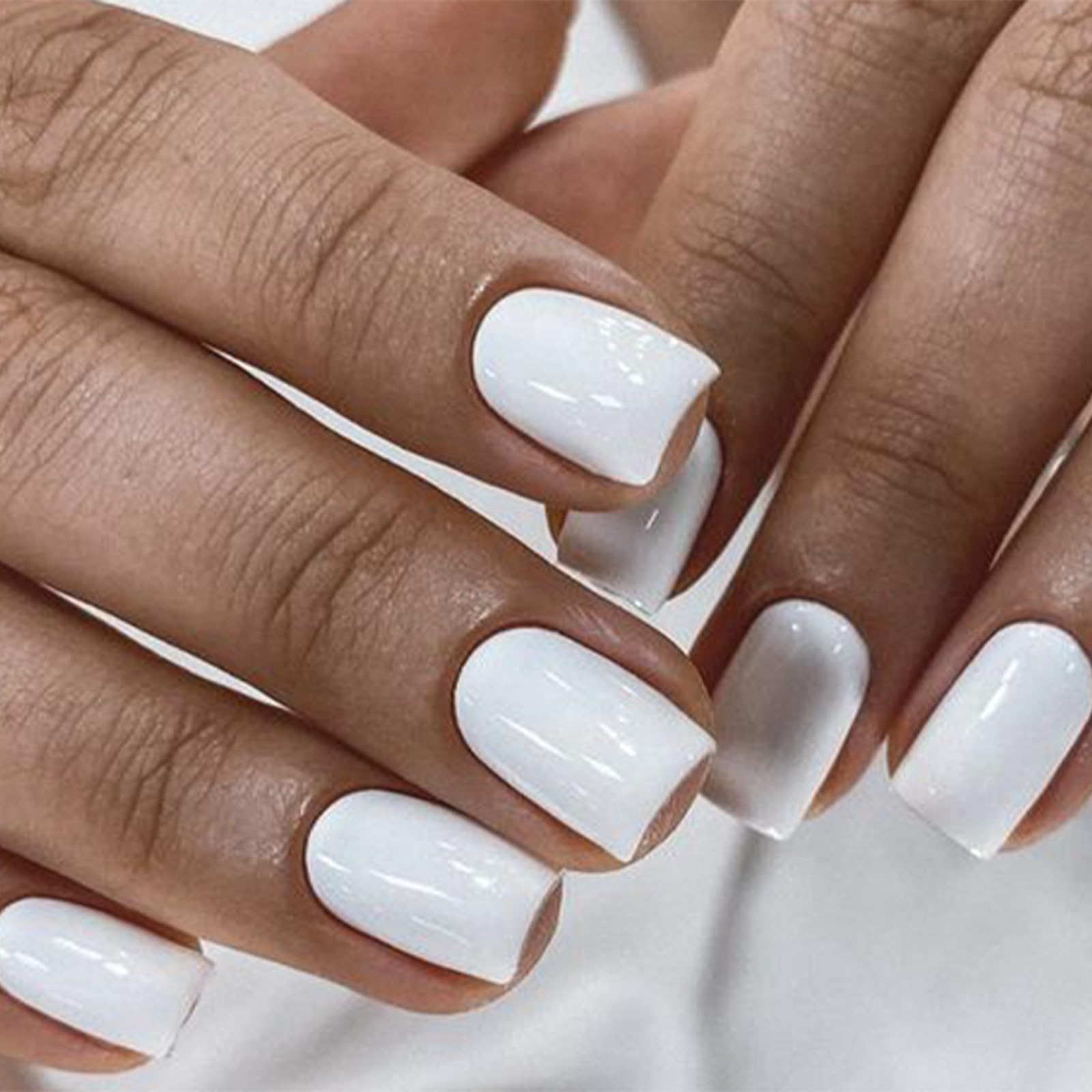 modelones close-up of short square pure white nail texture and finish