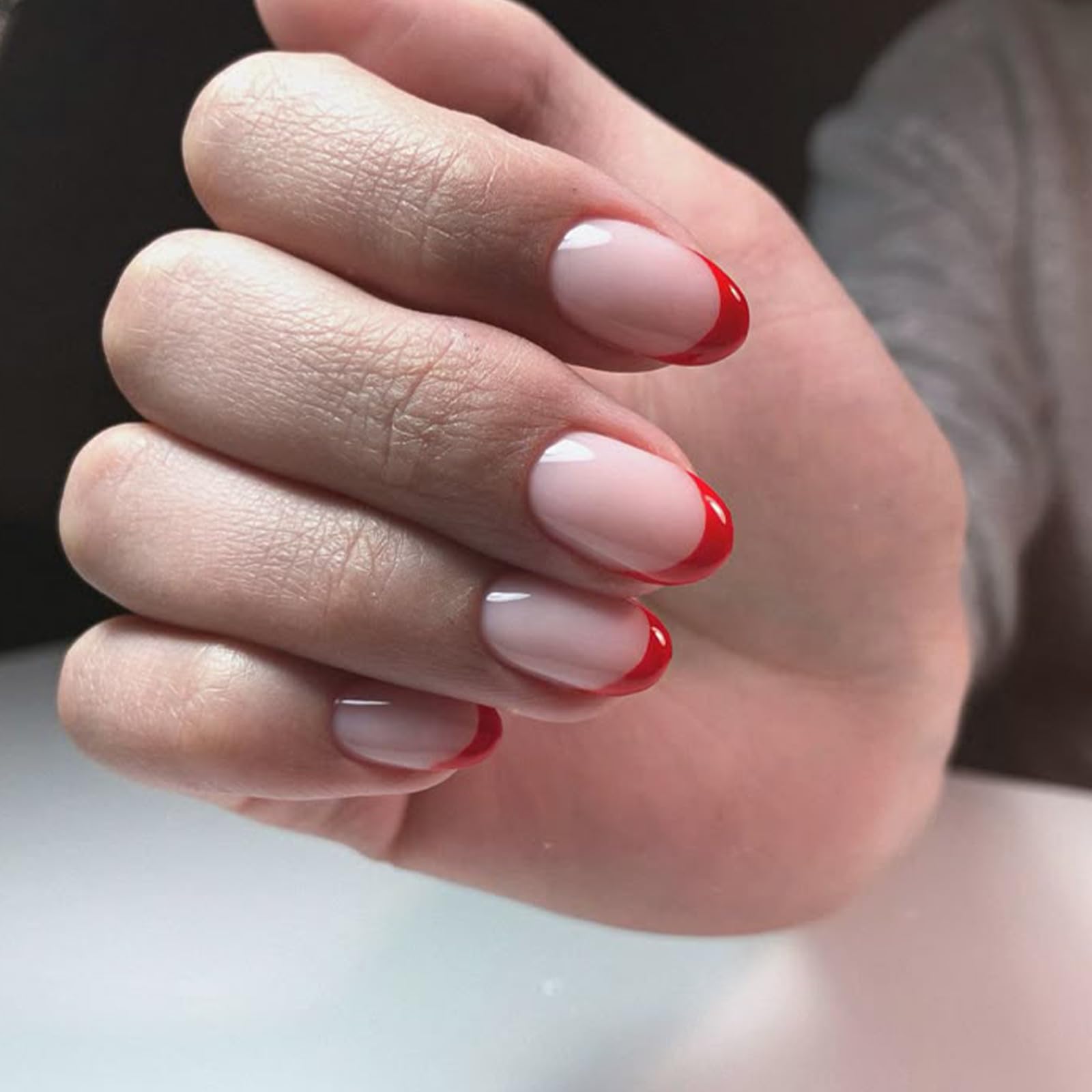 modelones close-up of red French tip detail benefit: shows crisp finish
