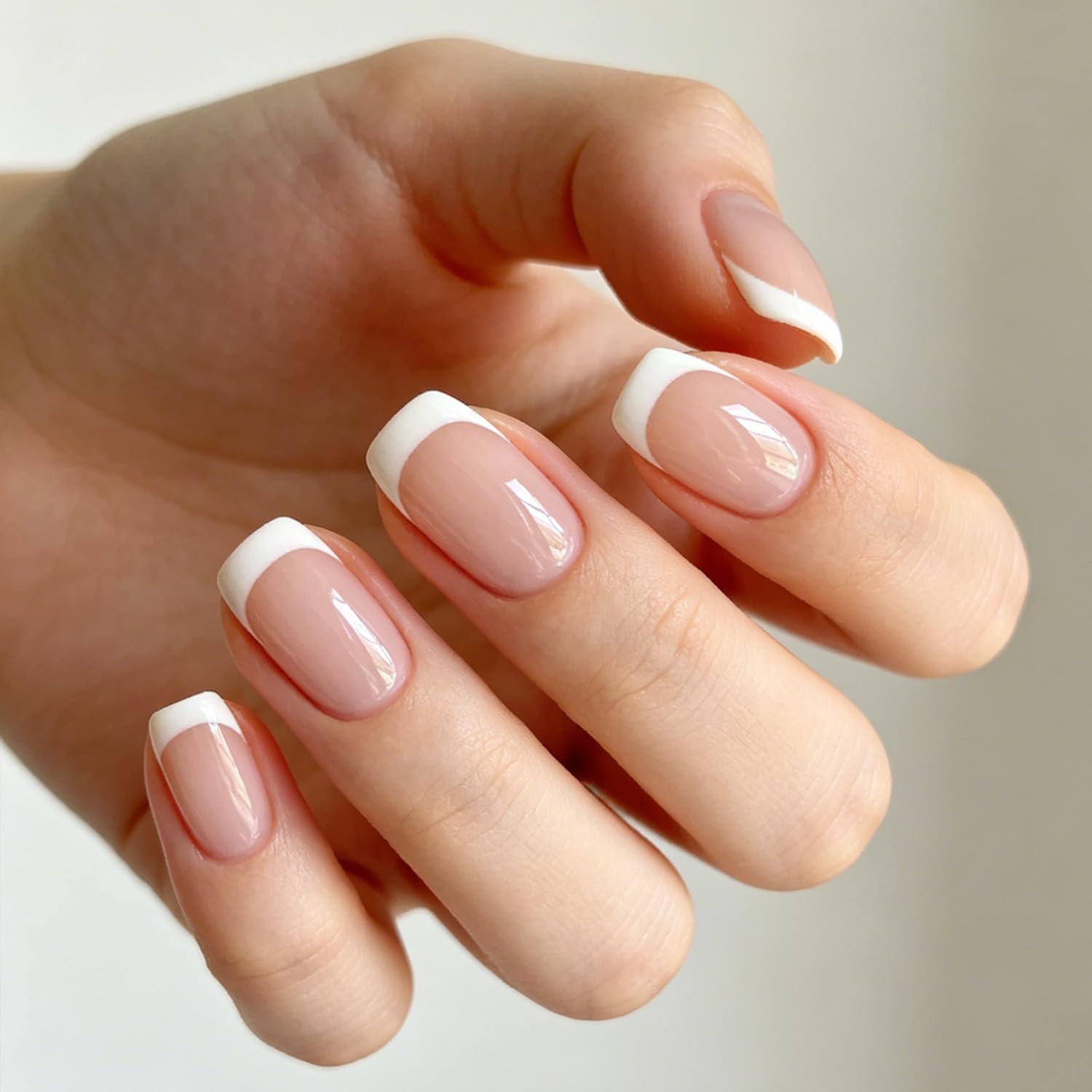 Modelones close-up of French tip detail highlighting crisp white line and smooth finish