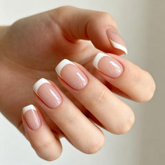 Modelones close-up of French tip detail highlighting crisp white line and smooth finish